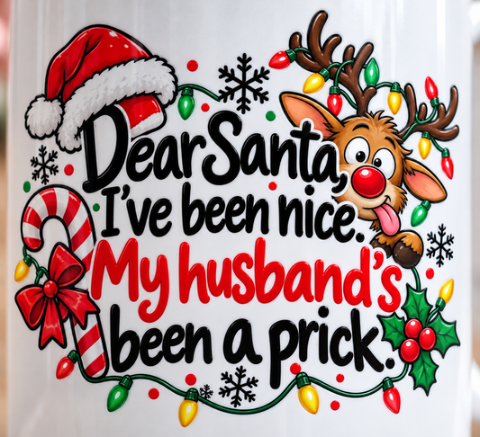 Close-up of funny Dear Santa Christmas mug print with cheeky husband quote, reindeer and colourful festive decorations