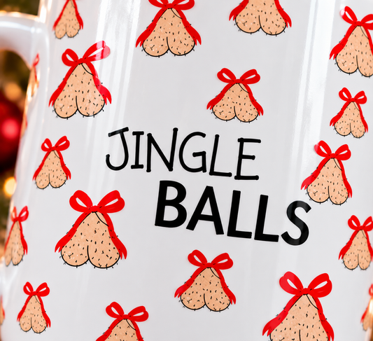 Close-up of Jingle Balls funny Christmas mug featuring cheeky festive illustrations with red bows and black lettering