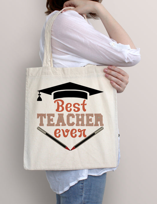 Woman carrying Best Teacher Ever cotton tote bag