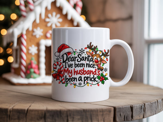 Funny Christmas ceramic mug with Dear Santa I've been nice my husband's been a prick quote and festive reindeer design