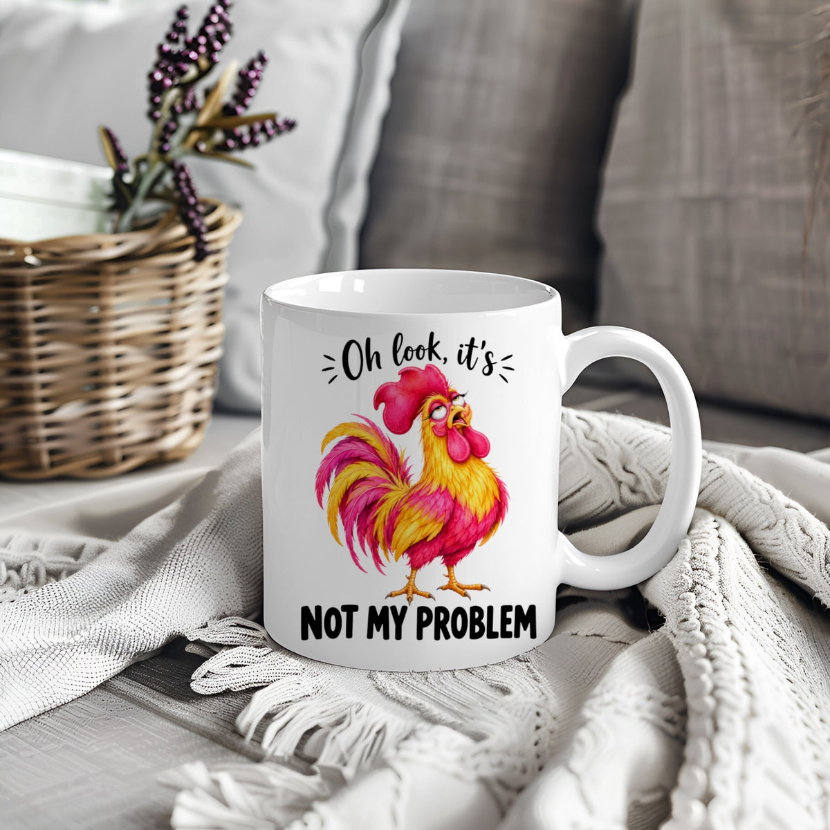 White mug with colourful rooster design and text Oh Look It's Not My Problem