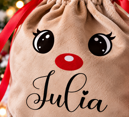 Close-up of personalised Julia name printed on soft velvet reindeer Christmas gift bag