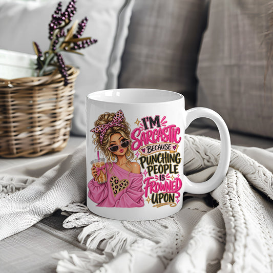 White mug with pink woman design and sarcastic quote about punching people