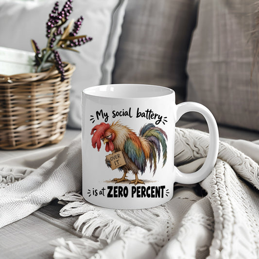 White mug with rooster design and text My Social Battery Is At Zero Percent
