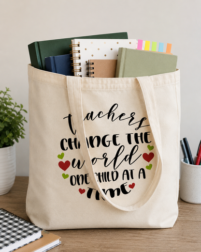 Teachers Change the World One Child at a Time cotton tote bag filled with books and notebooks